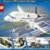 LEGO 60367 City Passagierflugzeug Spielzeug-Set, großes Flugzeug-Modell mit Fahrzeugen des Flughafen-Bodenpersonals: Vorfeldbus, Pushback-Schlepper, Catering-Lader, Gepäckwagen und 9 Minifiguren - 14